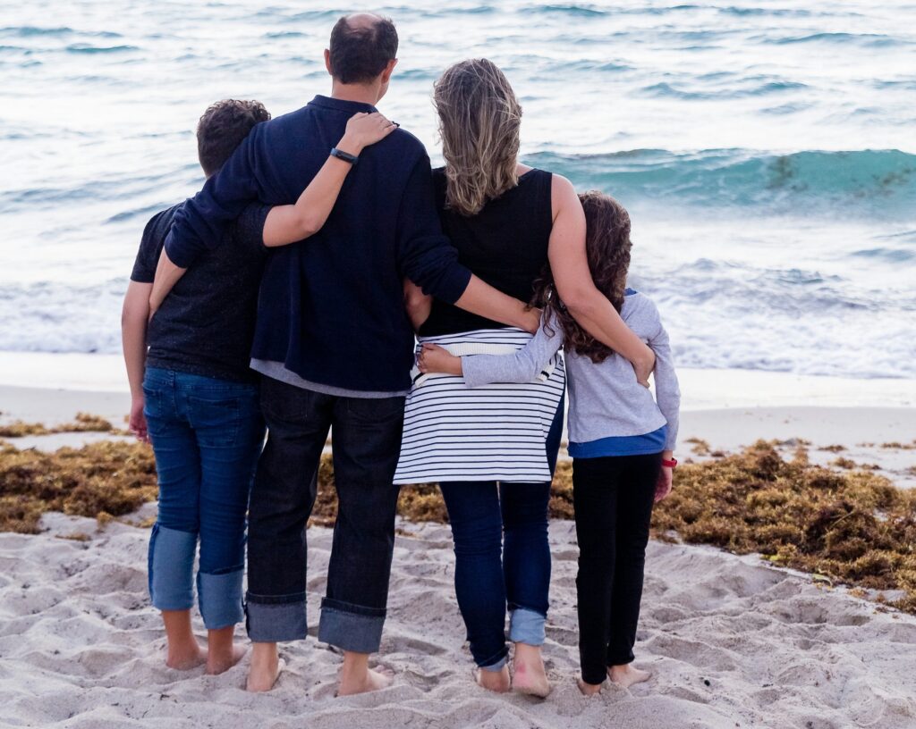 Family looking out at beach swell