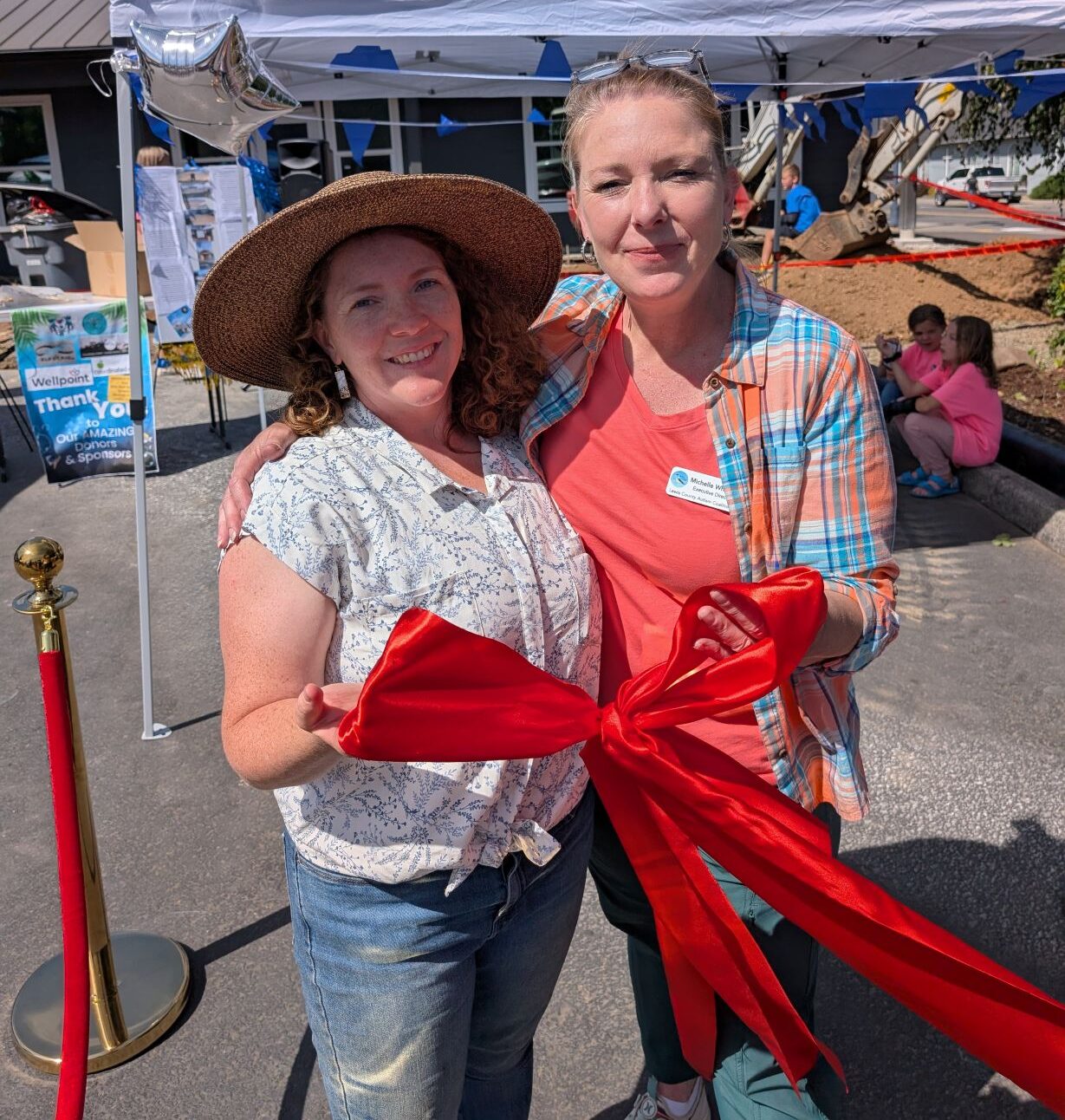 Davis Facilitator, Lindsay Hodge is pictured with Michelle Whitlow, Director of the Lewis County Autism Coalition at the ribbon cutting event for the new Spectrum and Development Community Center in Napavine Washinton, USA.